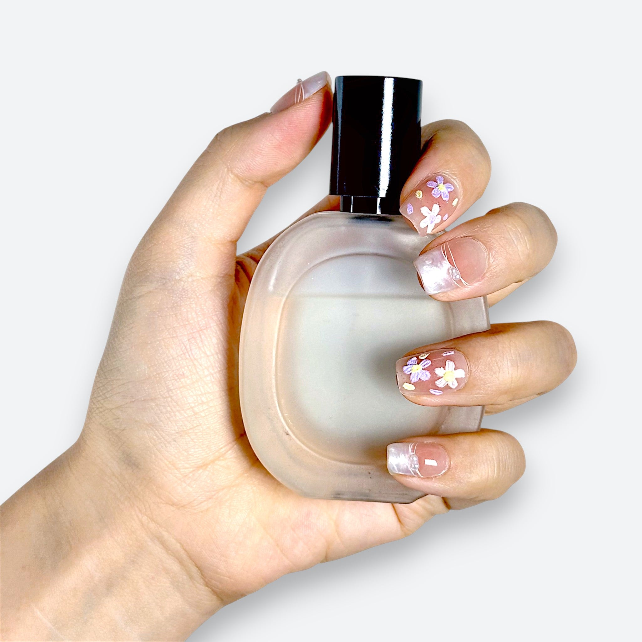 Detail shot of Velvetkay Blush Meadow nails. Soft pink handcrafted manicure with subtle art details.