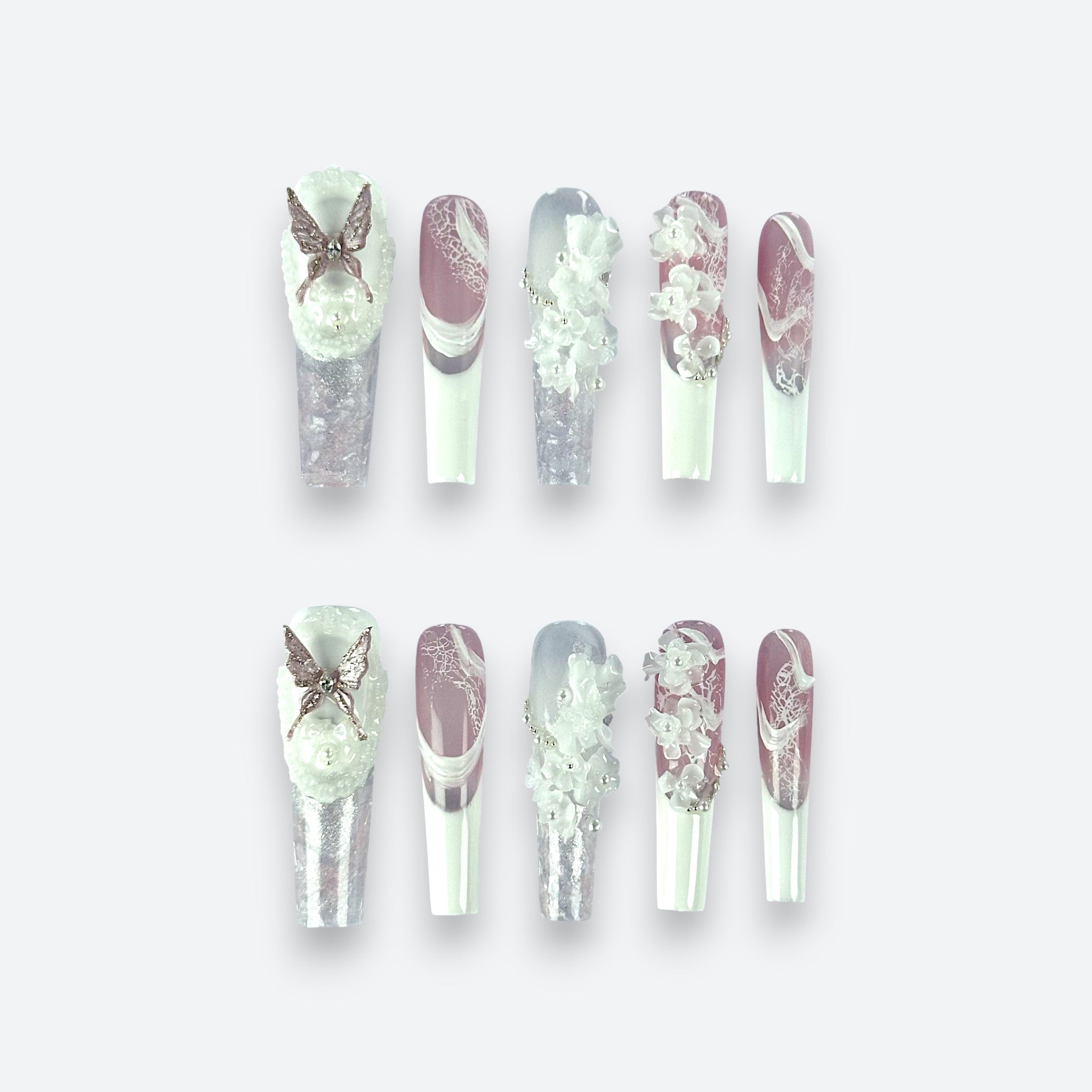 Full set of Velvetkay Ethereal Bloom handcrafted press-on nails in Coffin shape. Soft, dreamy luxury design.