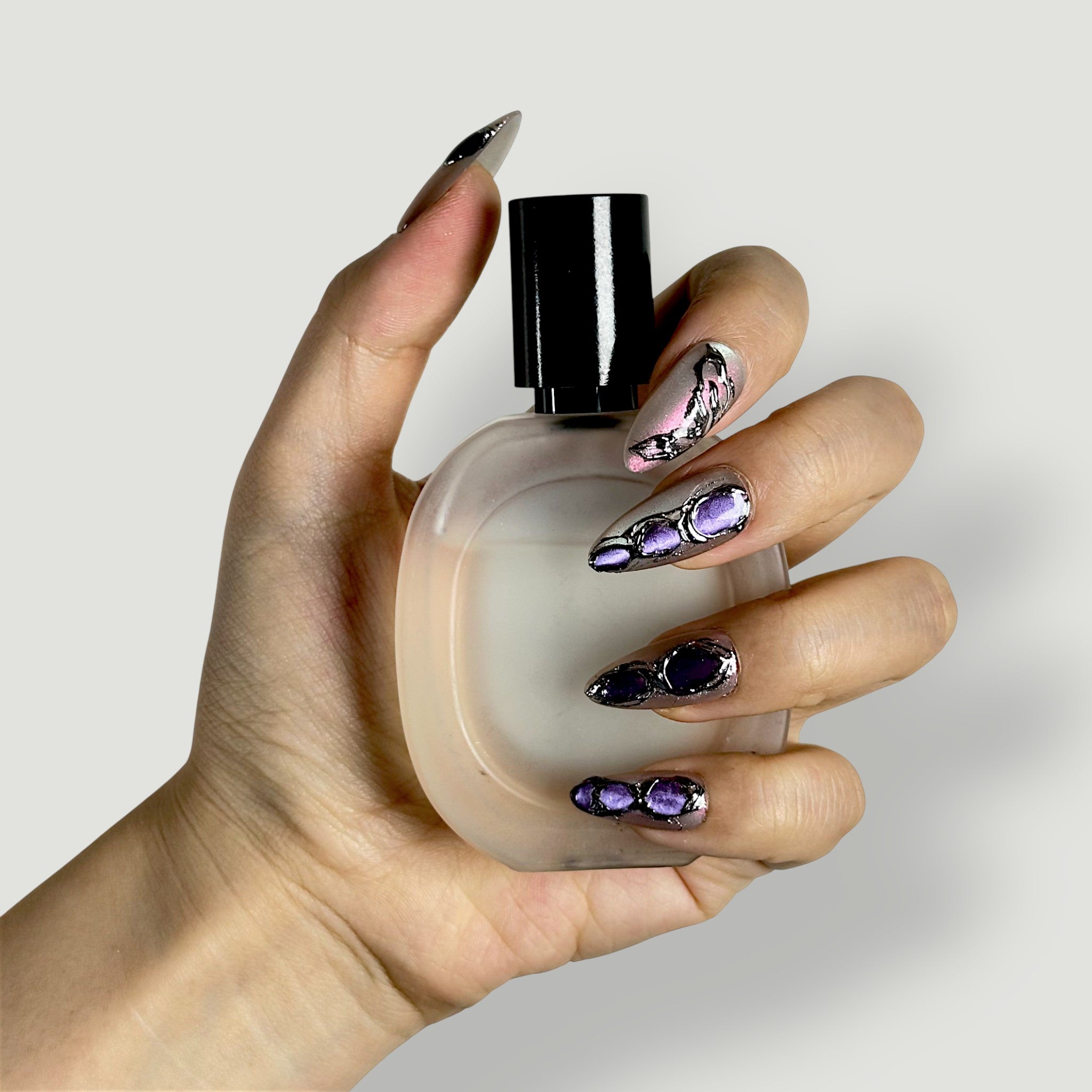 Close-up of Velvetkay Gemstone press-on nails in Almond shape. Handcrafted art with jewel-tone depth.