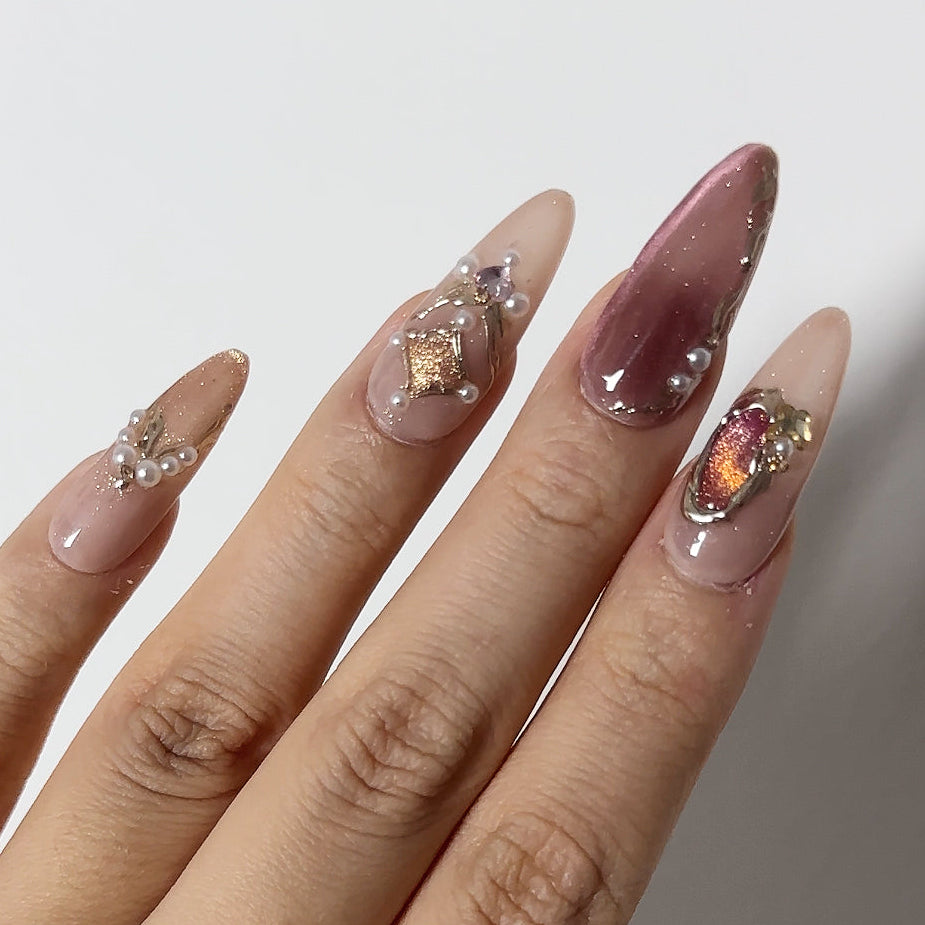 Vintage mauve cat-eye with large amber crystal charm and gold frame accents on luxury reusable structured gel.