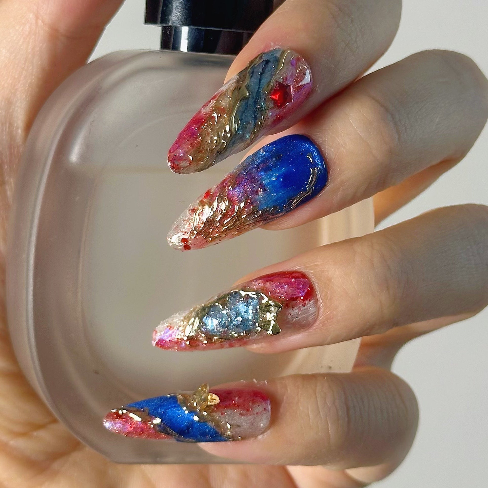 Abstract celestial blue and red marble long almond luxury reusable structured gel nails with gold foil by Velvetkay.