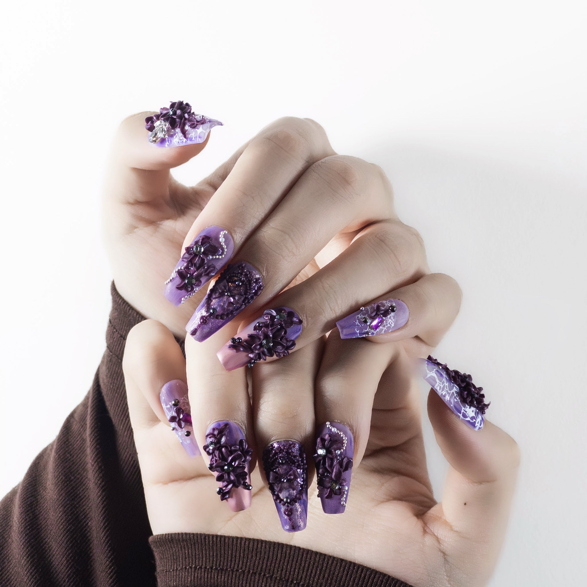 Macro shot of Velvetkay Lavender Drift nails showcasing the durable construction and Coffin shape design.