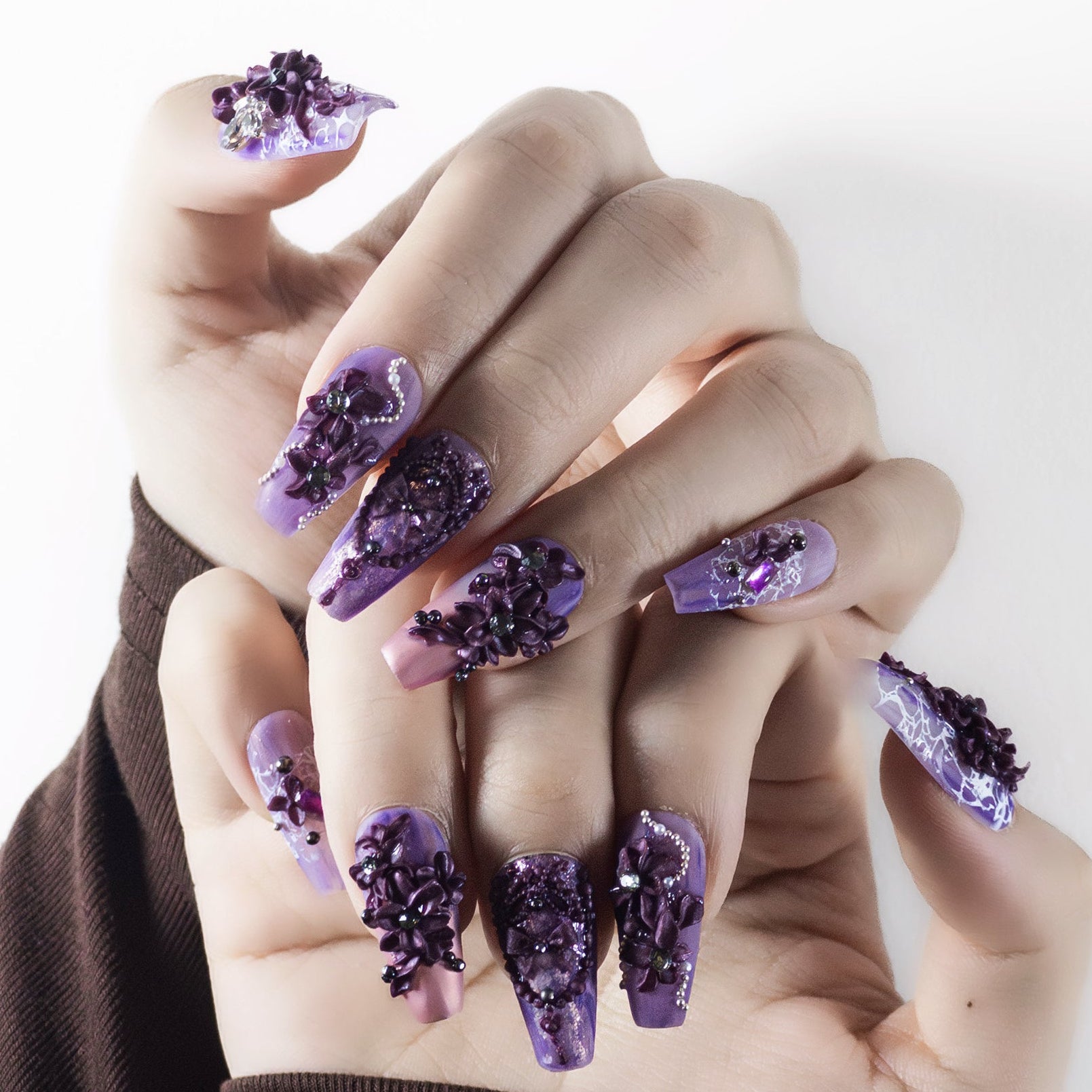 Macro shot of Velvetkay Lavender Drift nails showcasing the durable construction and Coffin shape design.