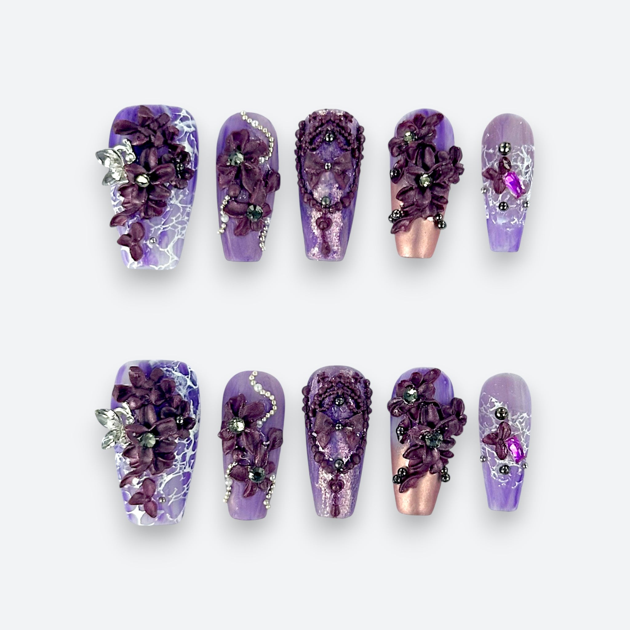 Velvetkay Lavender Drift press-on nails full set in Coffin shape. Purple handcrafted manicure with marble details.
