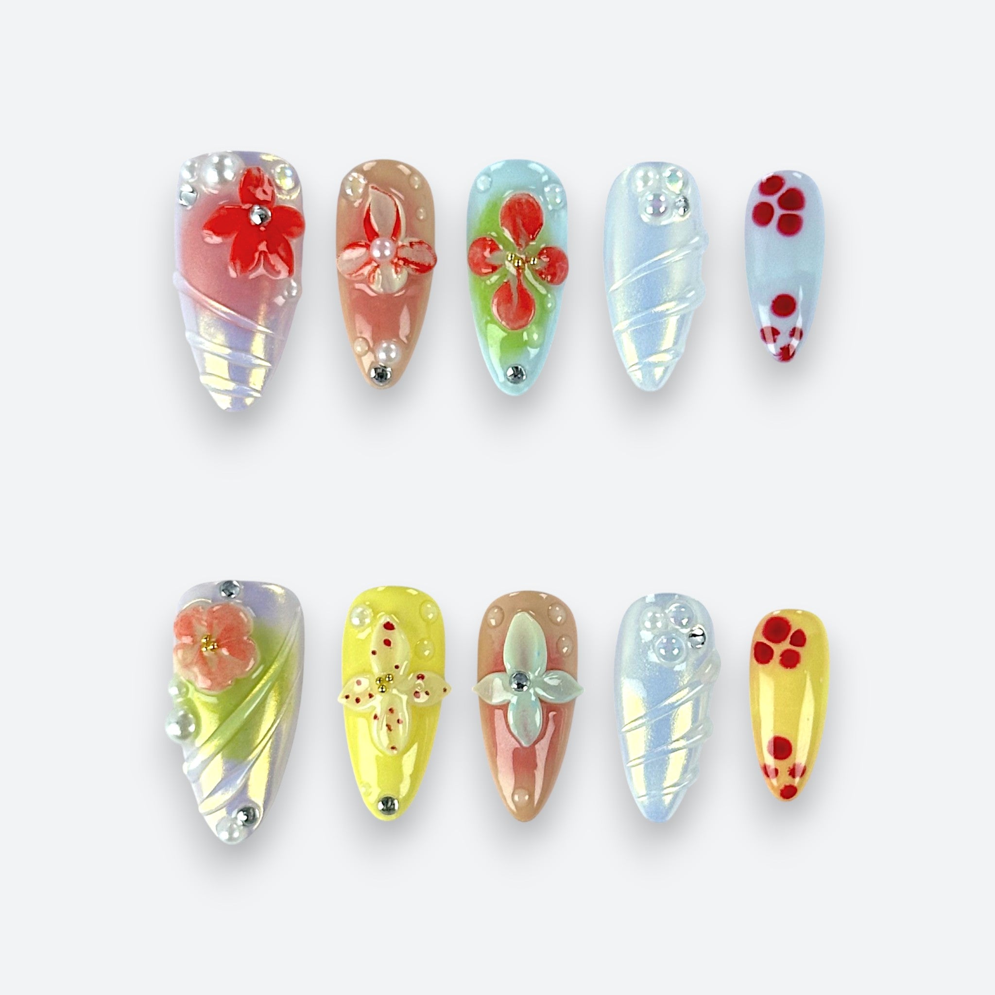 Full set view of Velvetkay Pastel Garden press-on nails in Almond shape. Spring-inspired floral design.