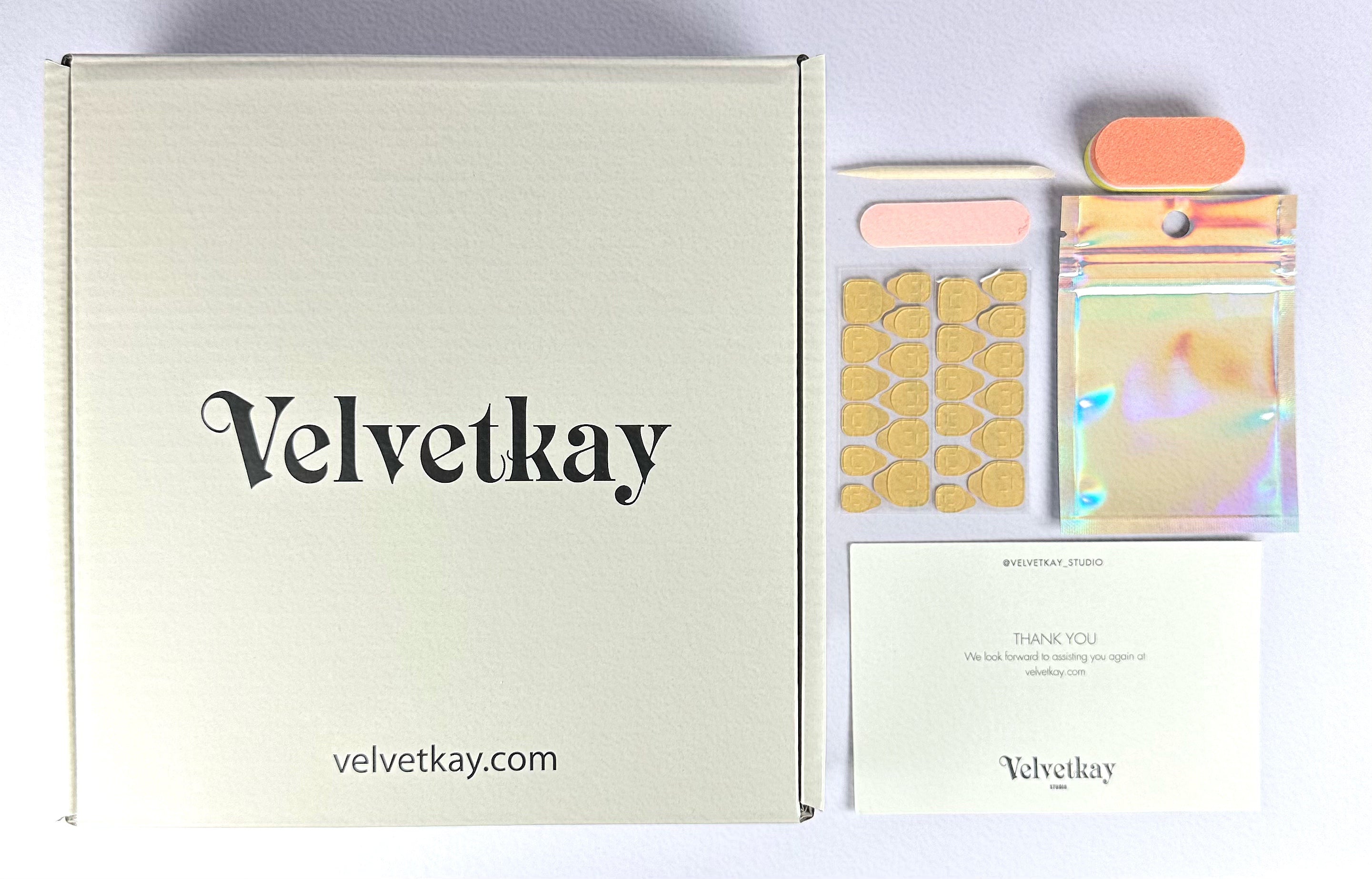 Velvetkay sizing kit and packaging elements. Essential for finding the perfect fit for your handcrafted manicure from Canada.