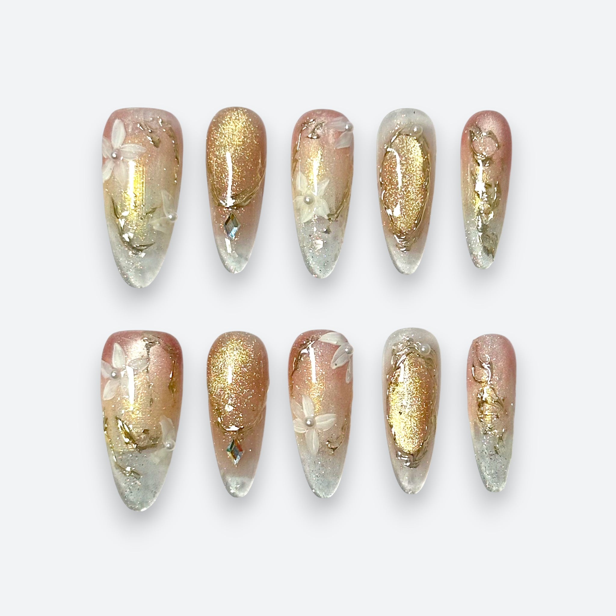 Ethereal champagne gold shimmer floral long almond luxury reusable structured gel nails by Velvetkay.