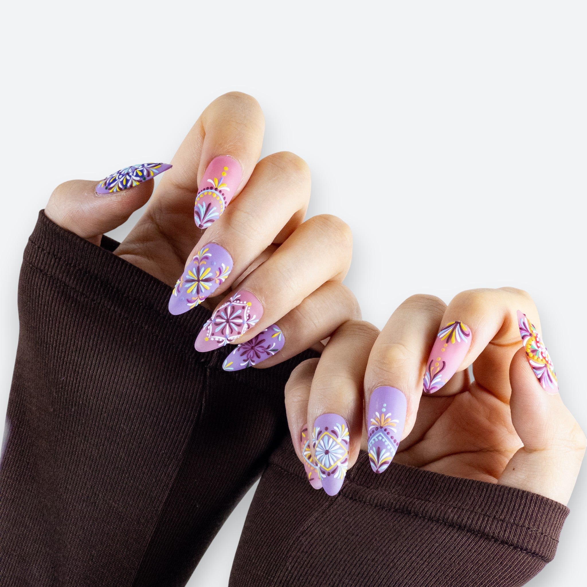 Close-up detail of Velvetkay Rosette press-on nails, showing the delicate design and salon-quality finish.