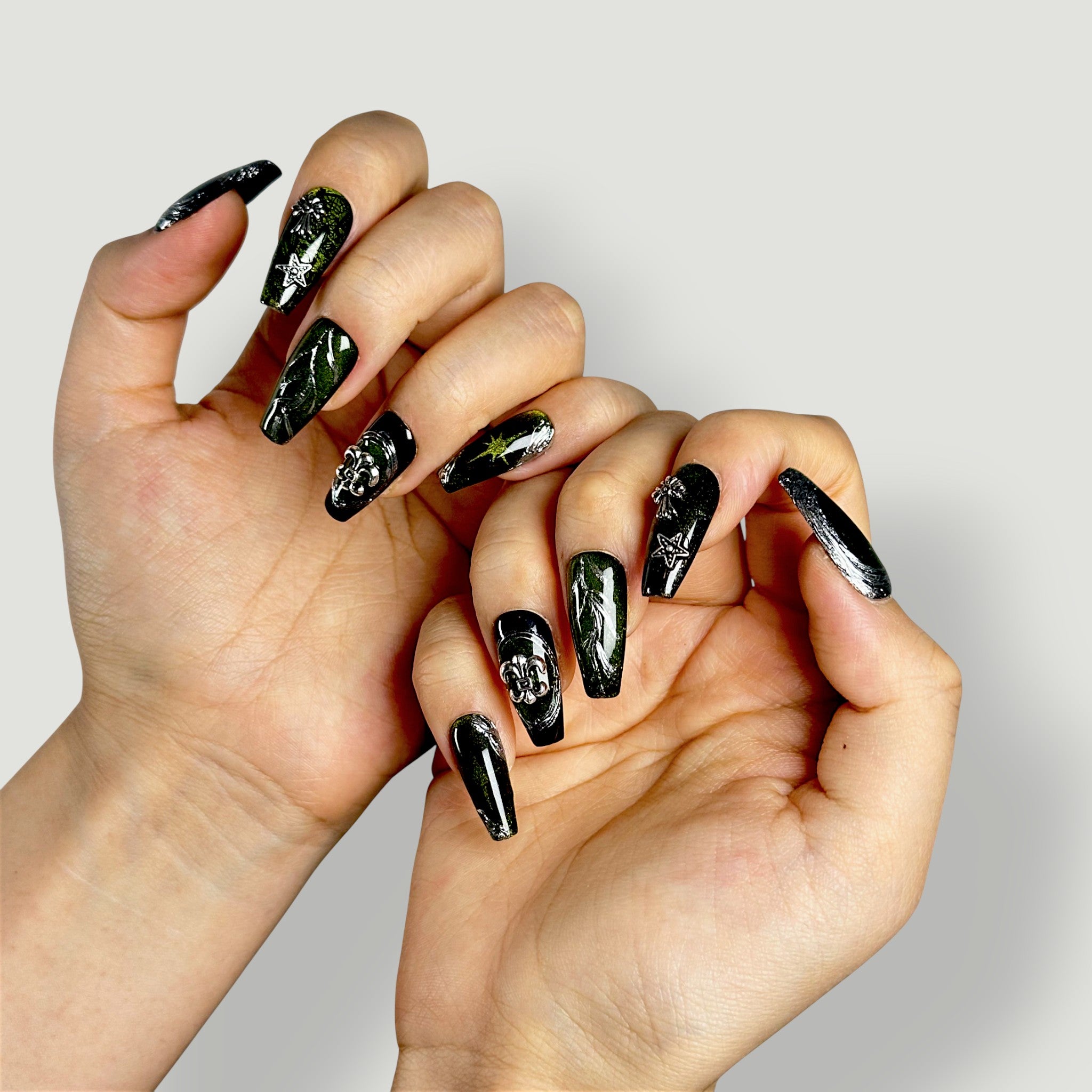Close-up of Velvetkay Starshade press-on nails in Coffin shape. Dark celestial-inspired design.