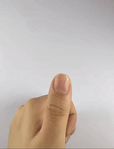 Step 1 of applying Velvetkay press-on nails: Gently pushing back cuticles with the included tool for a perfect fit.