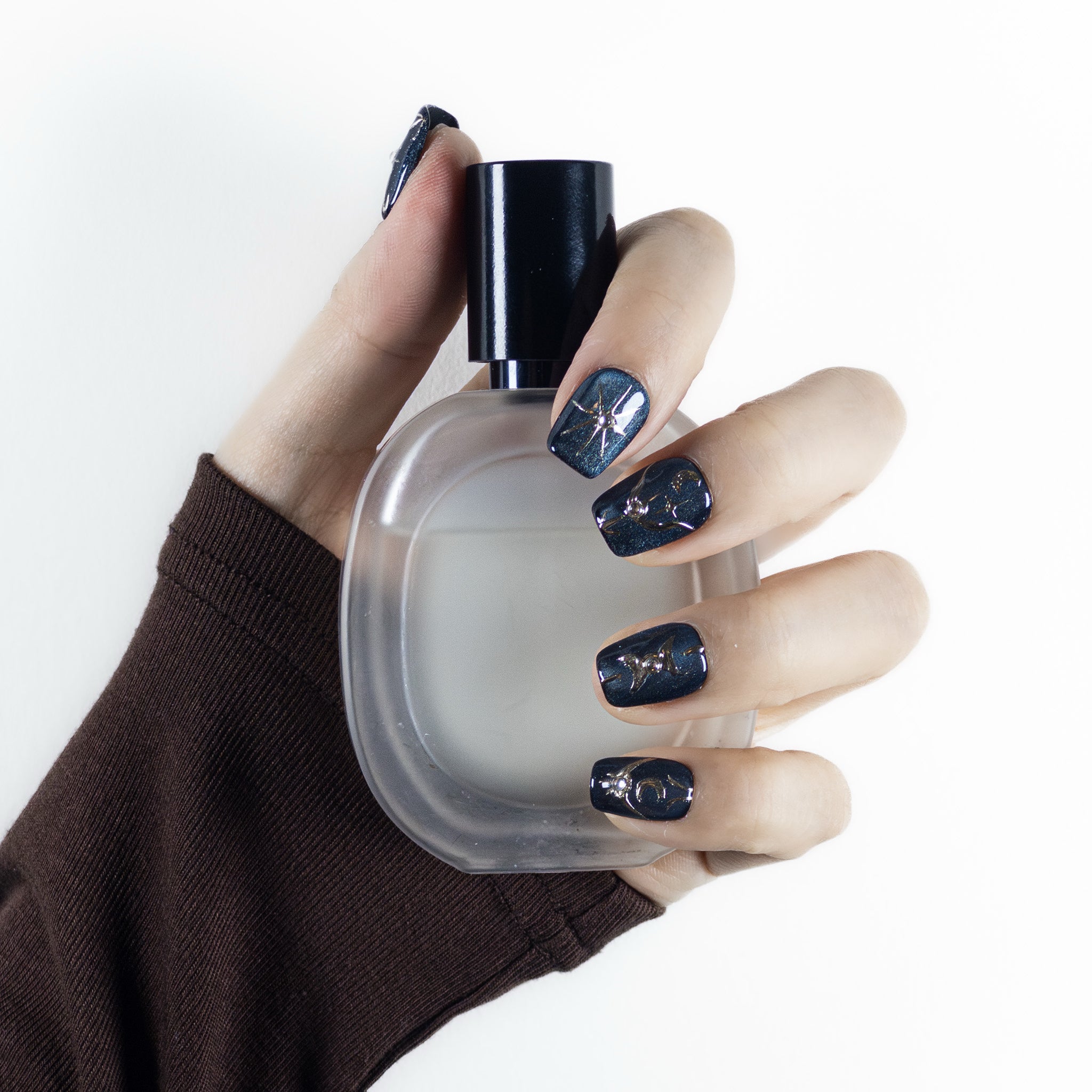 Close-up detail of Velvetkay Astral Vault press-on nails, highlighting the unique art and premium material.