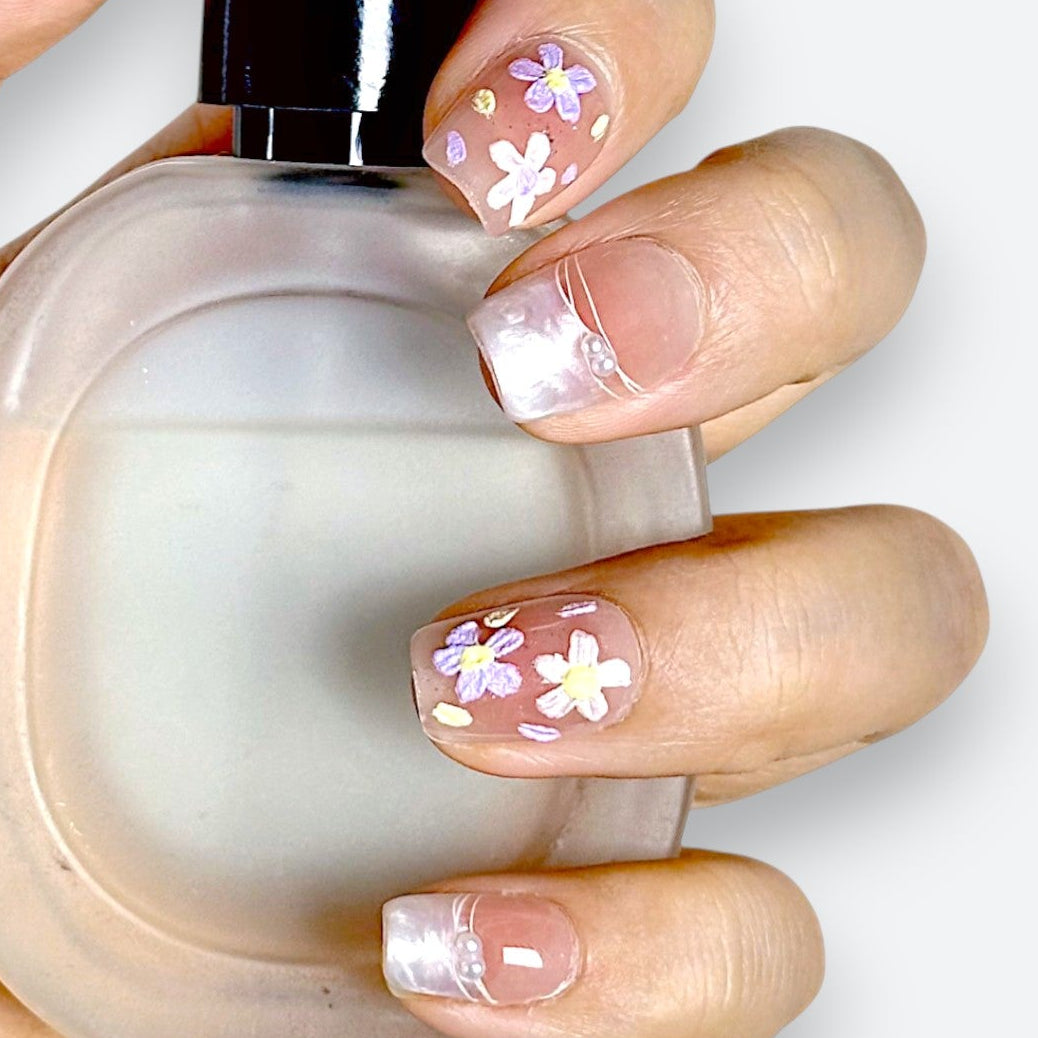 Detail shot of Velvetkay Blush Meadow nails. Soft pink handcrafted manicure with subtle art details.