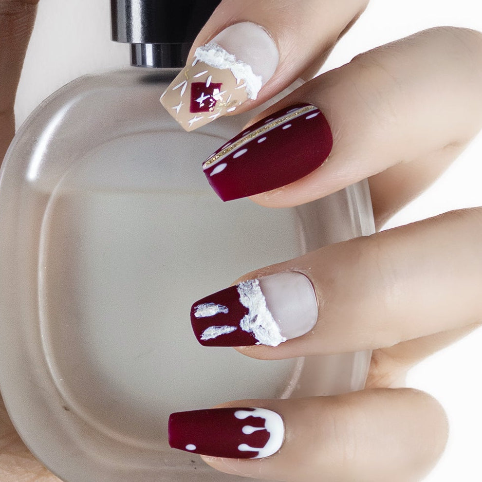 Texture detail of Velvetkay Crimson Noel handcrafted nails. Durable salon-quality finish for the holidays.