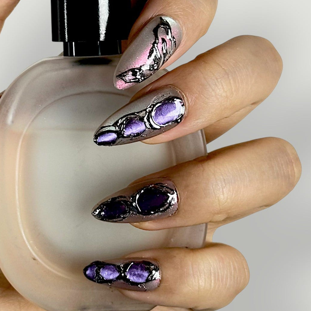 Close-up of Velvetkay Gemstone press-on nails in Almond shape. Handcrafted art with jewel-tone depth.