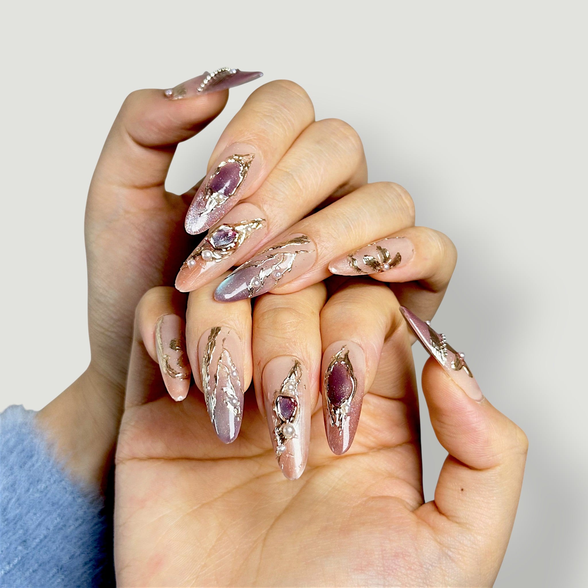 Velvetkay Gilded Mirage handcrafted press-on nails. Elegant reusable manicure with gold details.