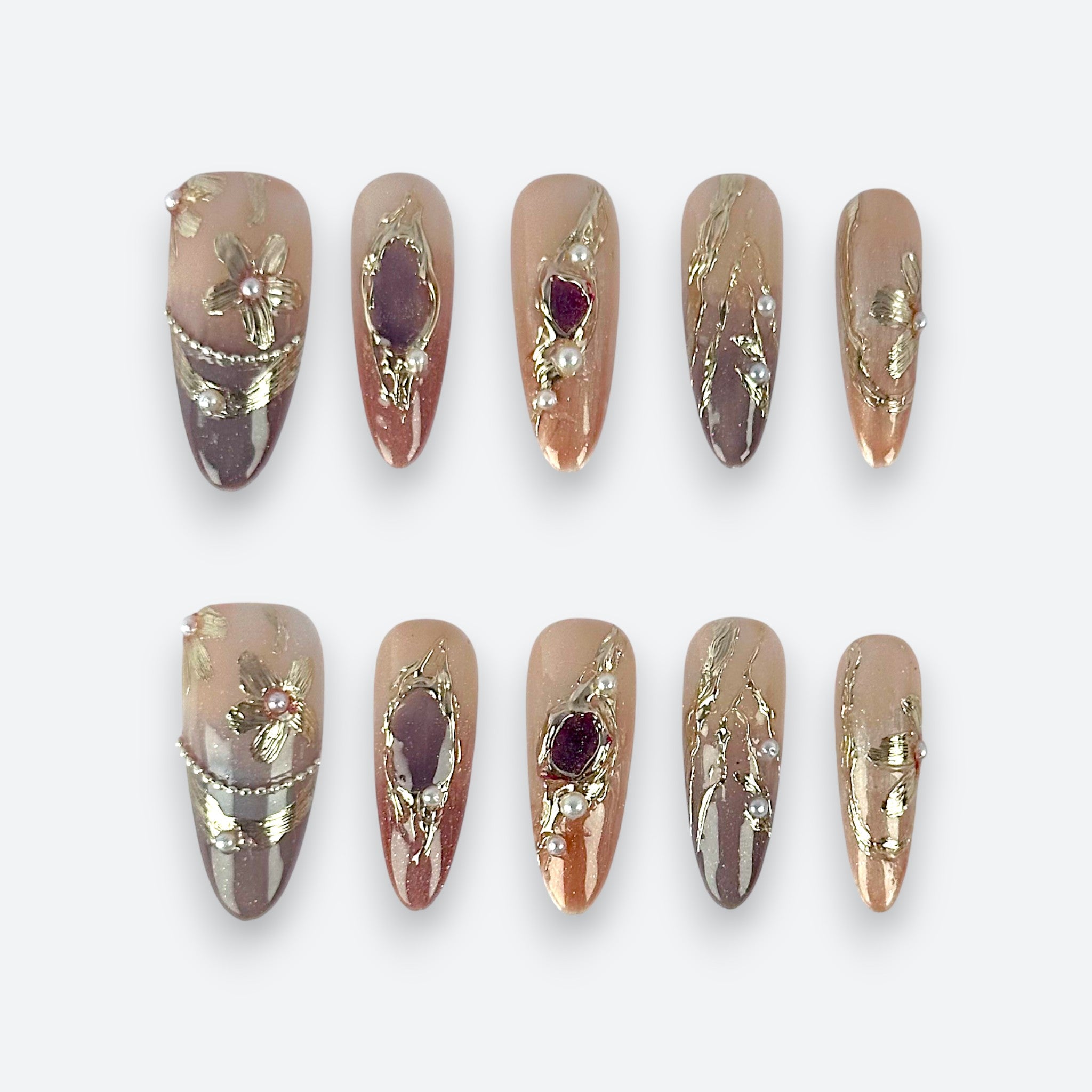 Velvetkay Gilded Mirage press-on nails full set in Almond shape. Handcrafted design with gold accents.