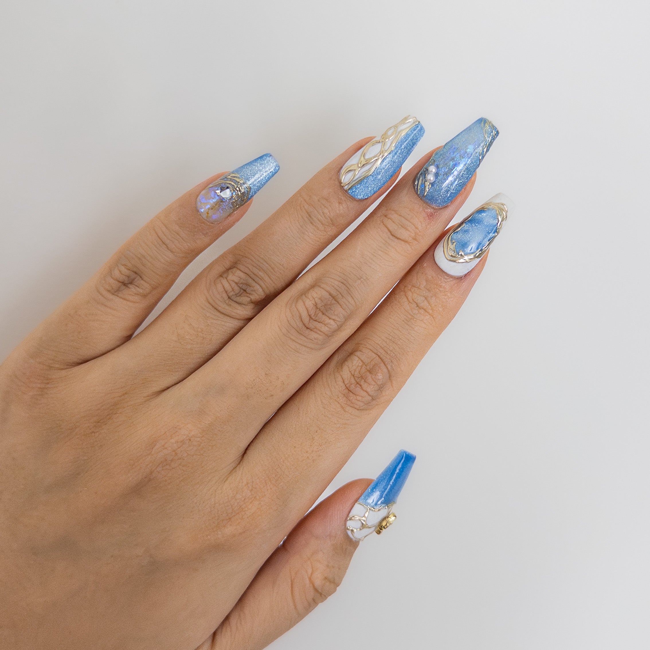 Shimmering blue and white marble coffin handcrafted gel press-on nails Glacier Sonata by Velvetkay.