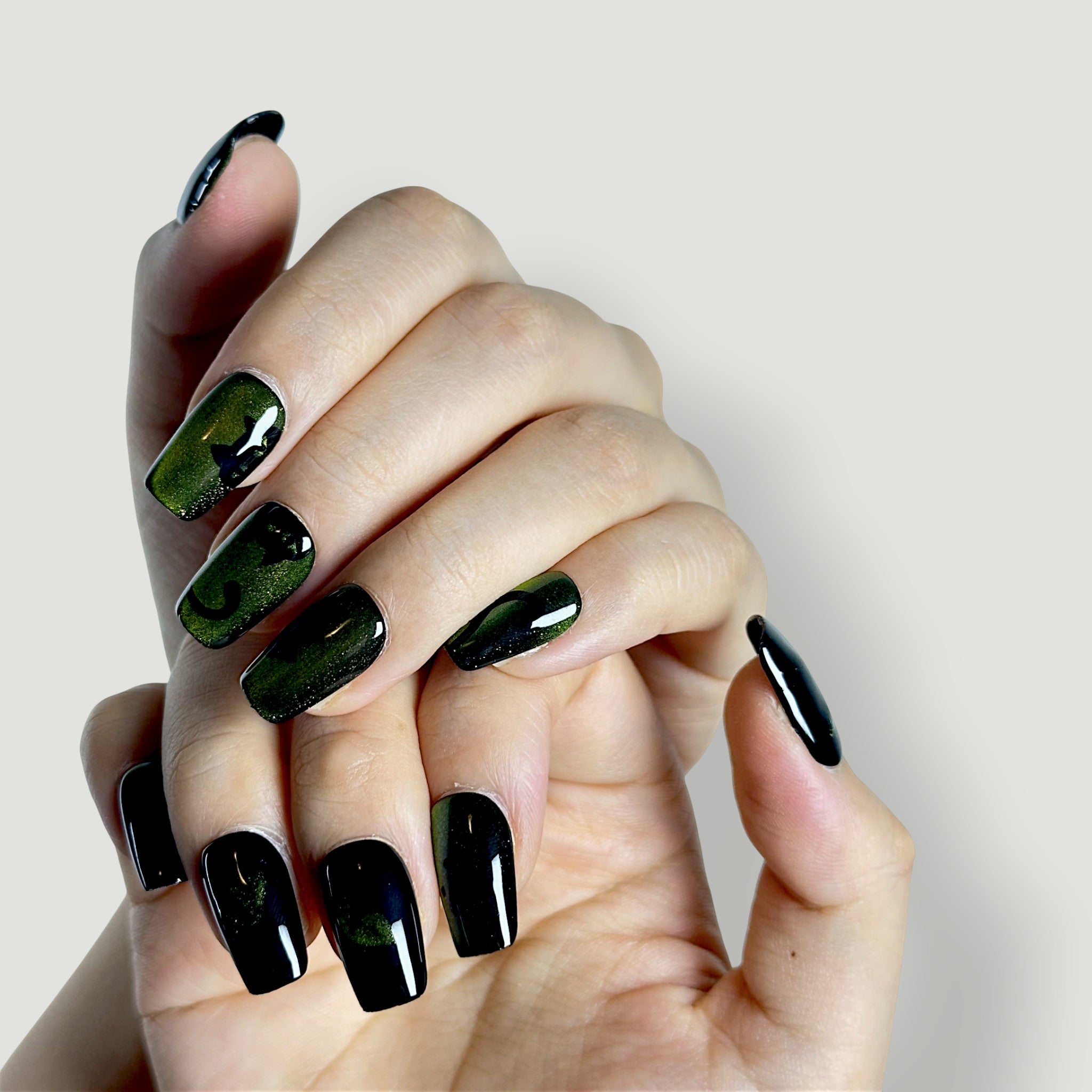 Close-up of Velvetkay Night Prowler press-on nails in Square shape. Dark, modern luxury design.