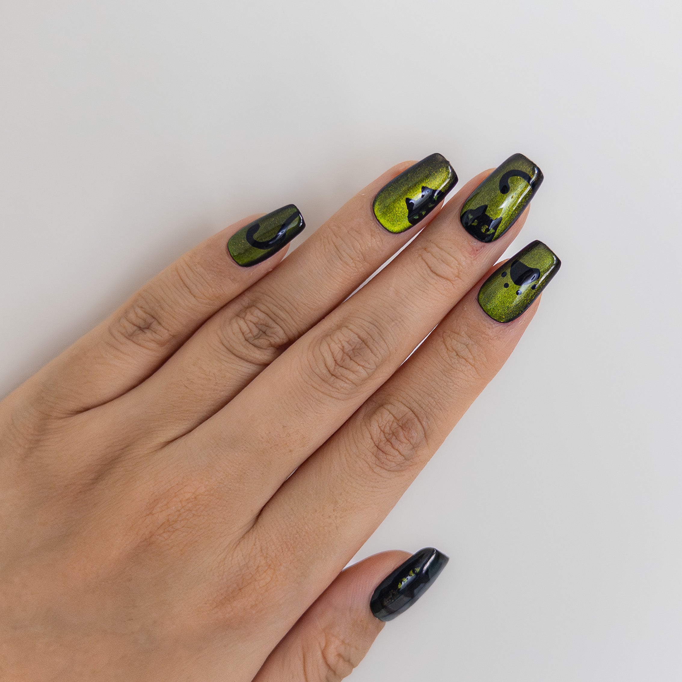 Green magnetic cat-eye tapered square handcrafted gel press-on nails with whimsical cat art by Velvetkay.