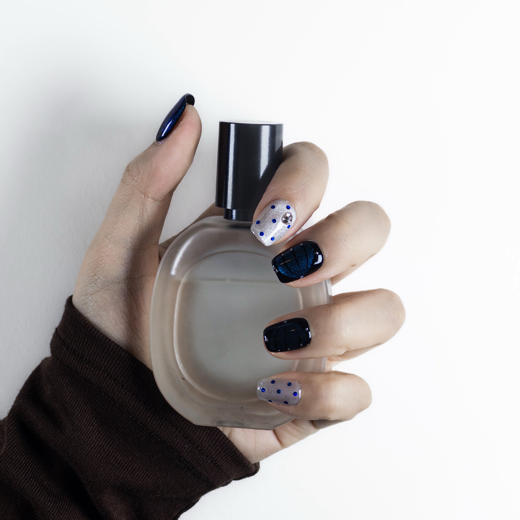 Velvetkay Obsidian Night handcrafted press-on nails. Elegant dark reusable manicure set made in Toronto.