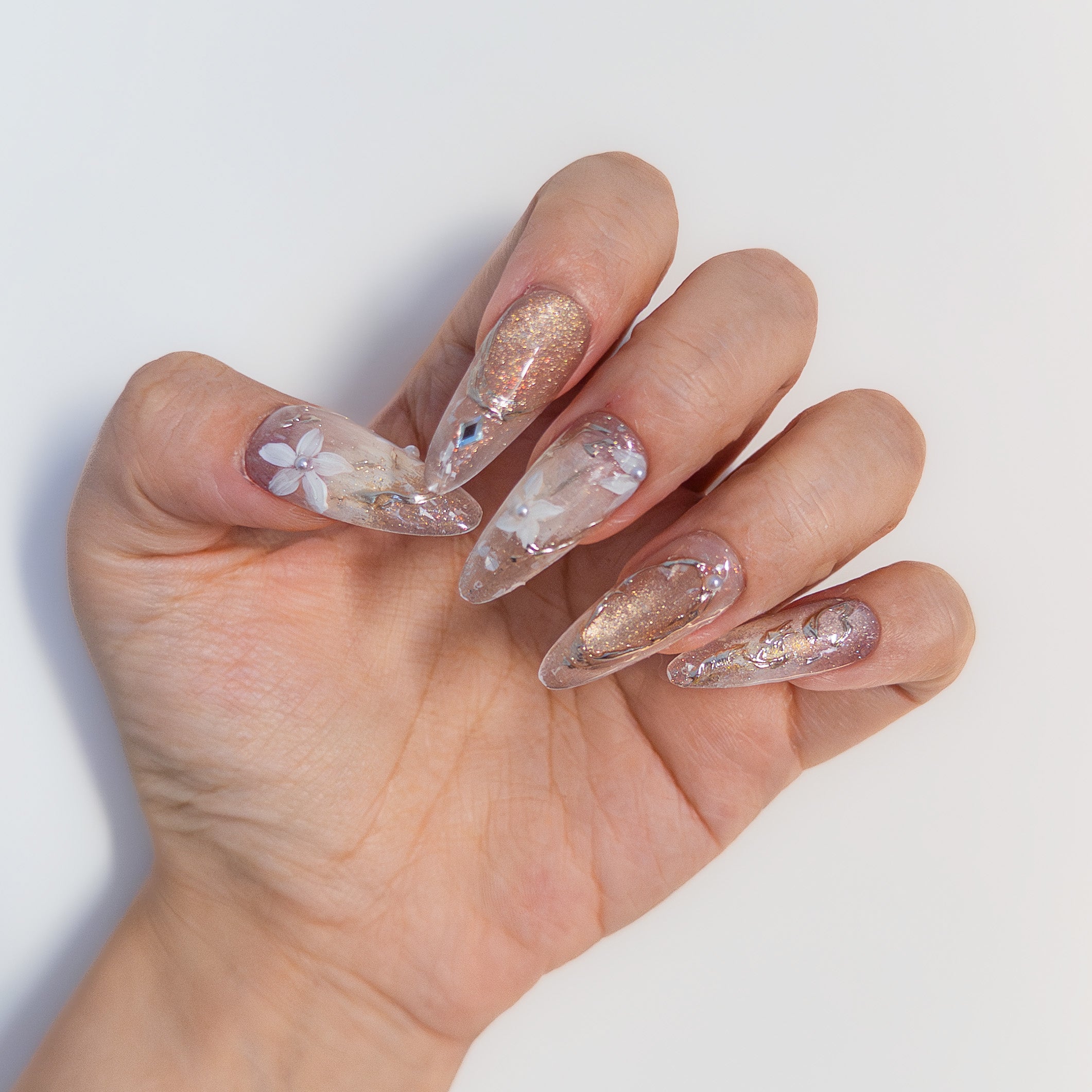 Ethereal white marble and gold foil almond reusable gel nails by Velvetkay.