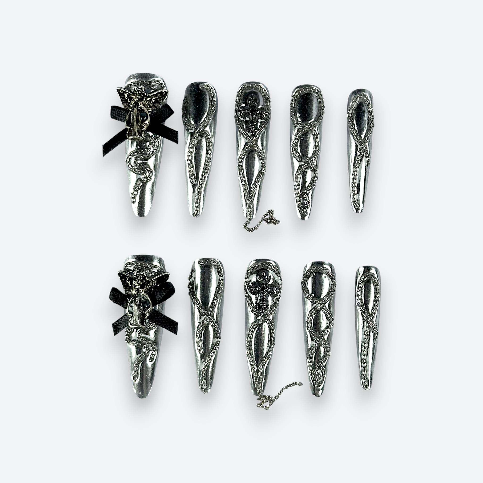 Full set view of Velvetkay Silver Siren handcrafted press-on nails in Stiletto shape. Metallic silver luxury design.